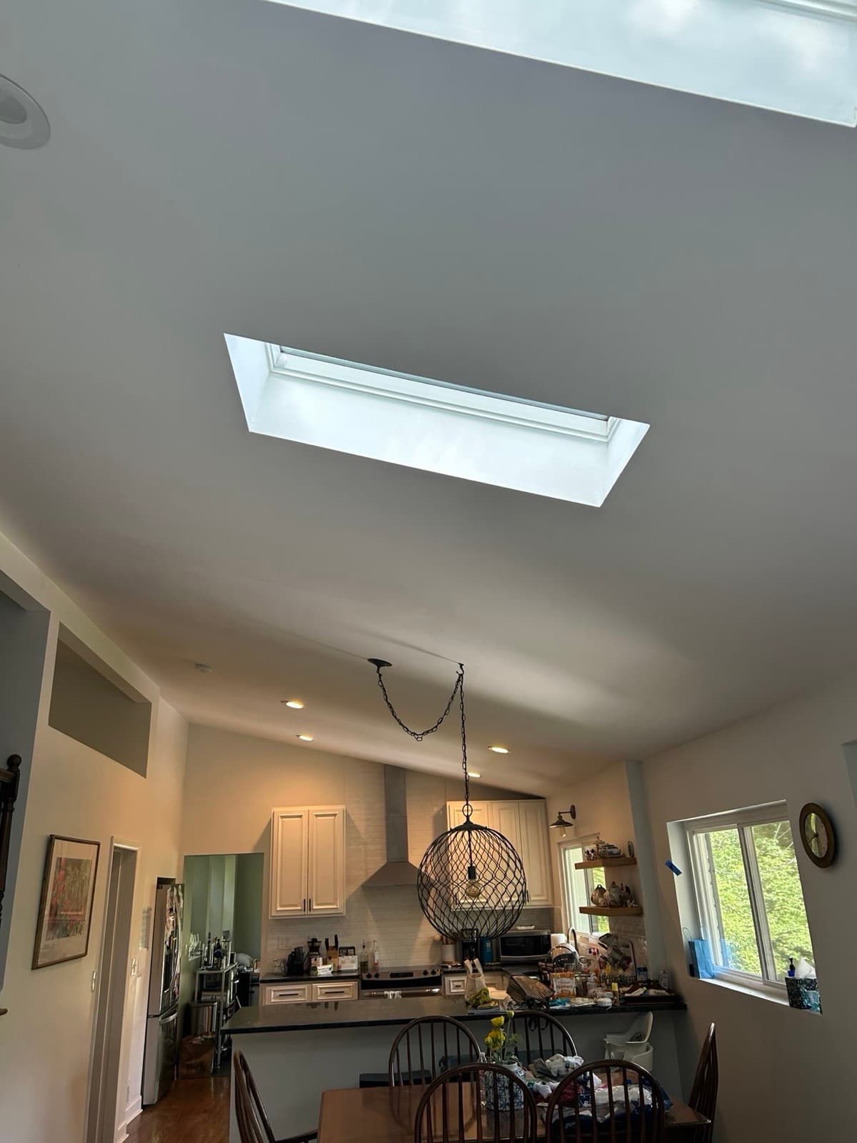 Bright kitchen interior with skylights after a roof and skylight replacement