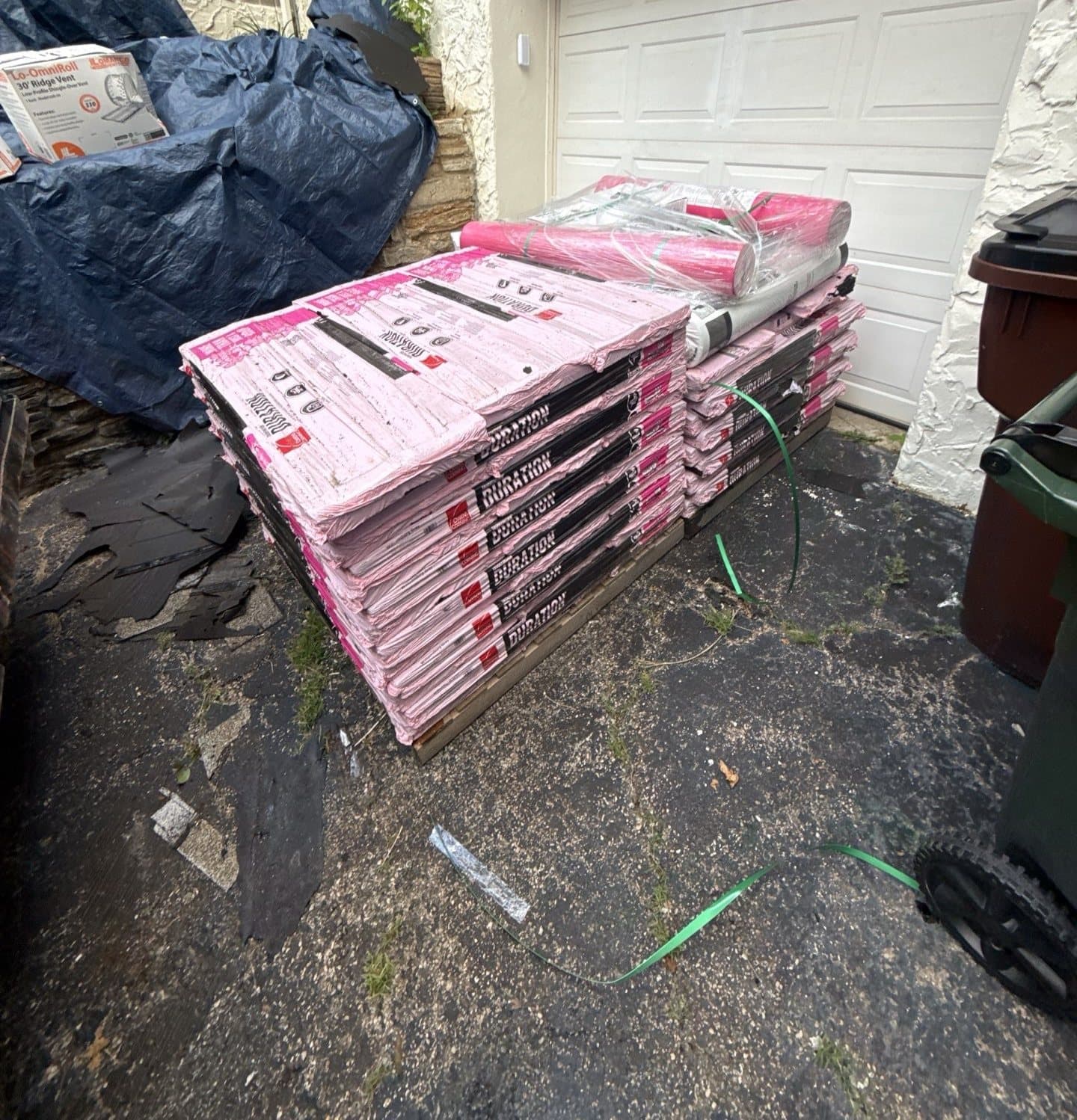 Pallets of Owens Corning Duration shingles delivered to a Cincinnati home for an insurance roof replacement
